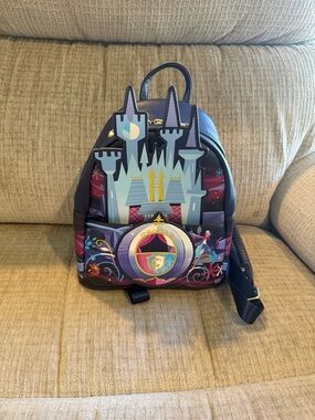 Disney loungefly of Cinderella and her castle appliquéd and embroidered